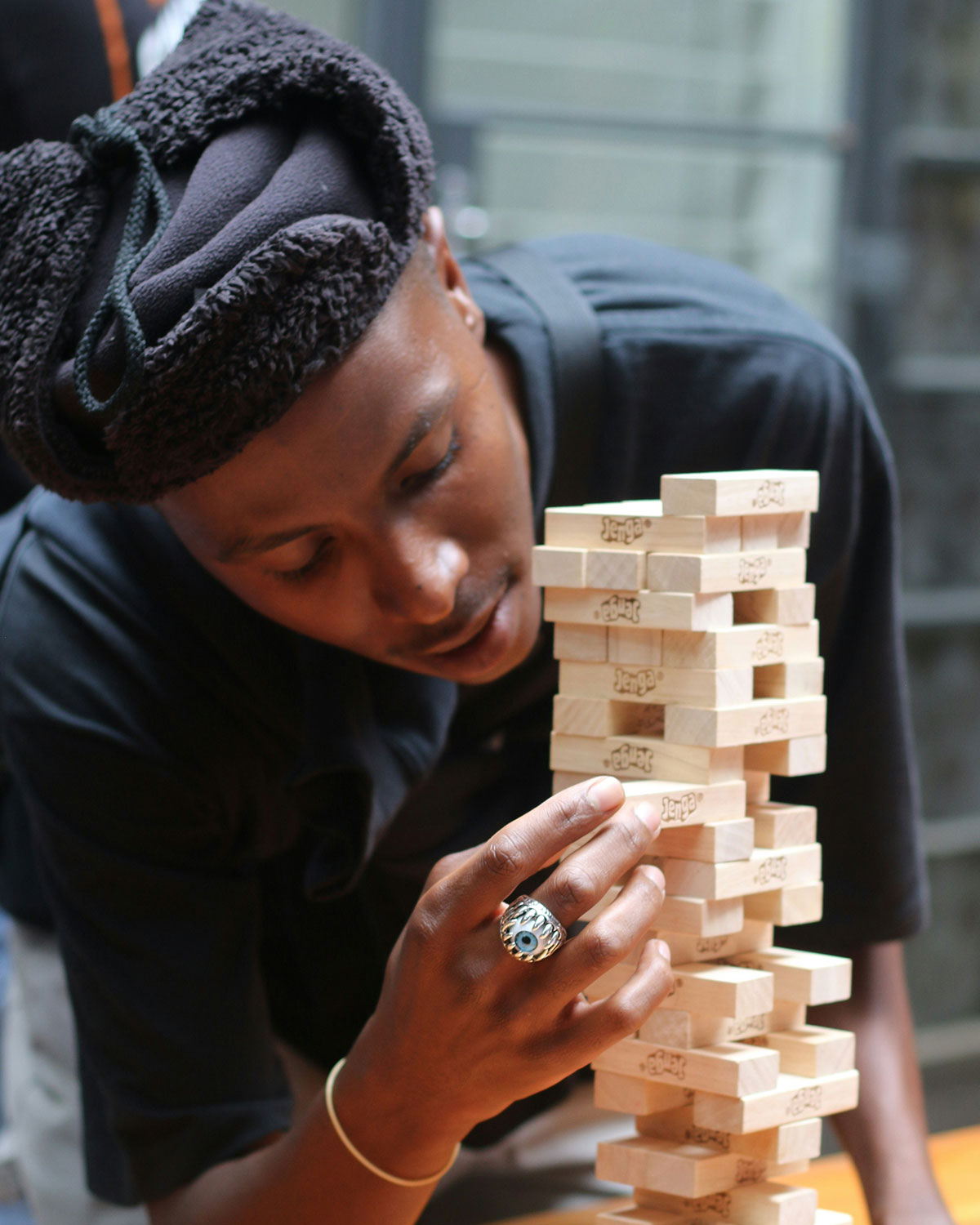 Young man playing Jenga