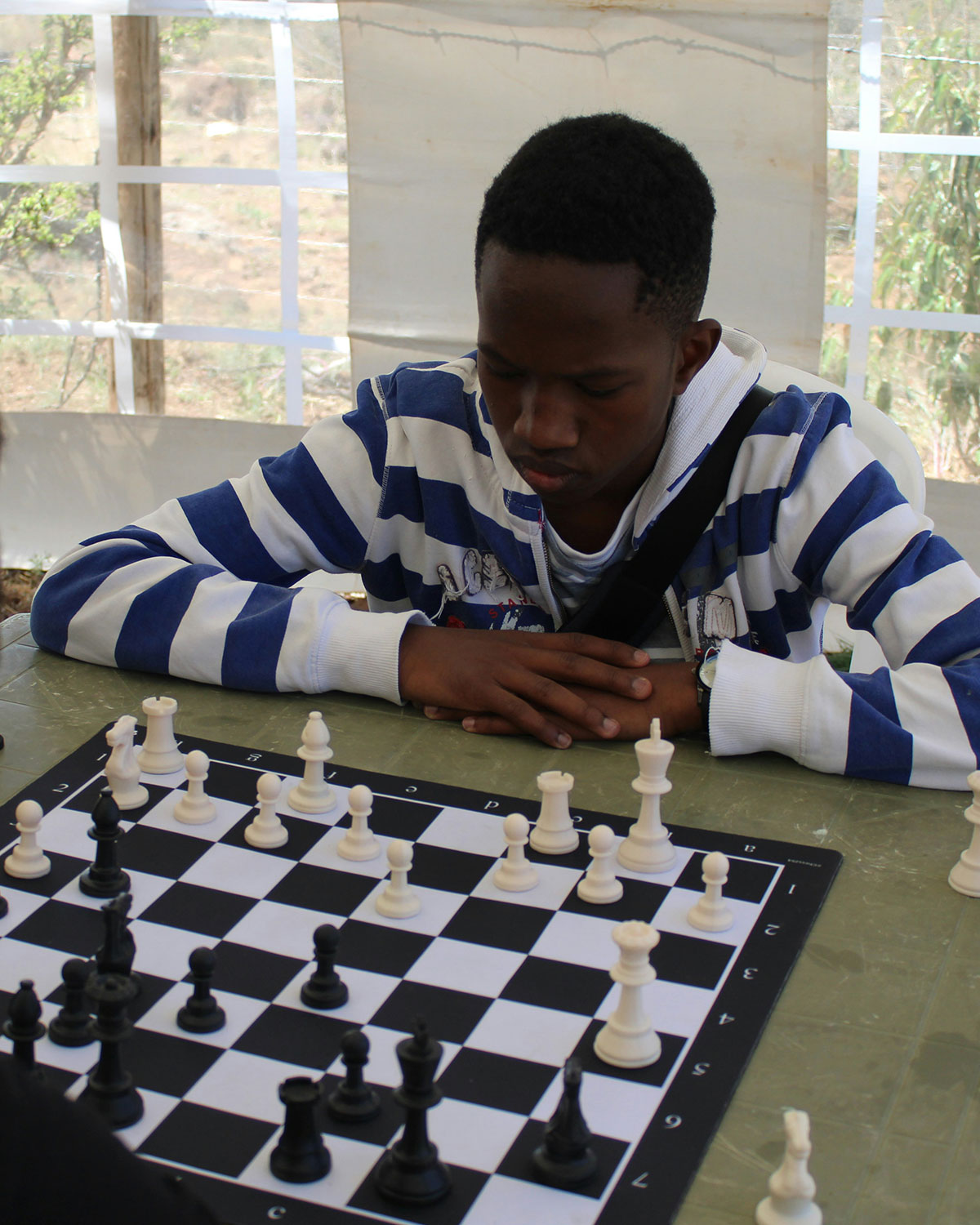 Young man playing chess