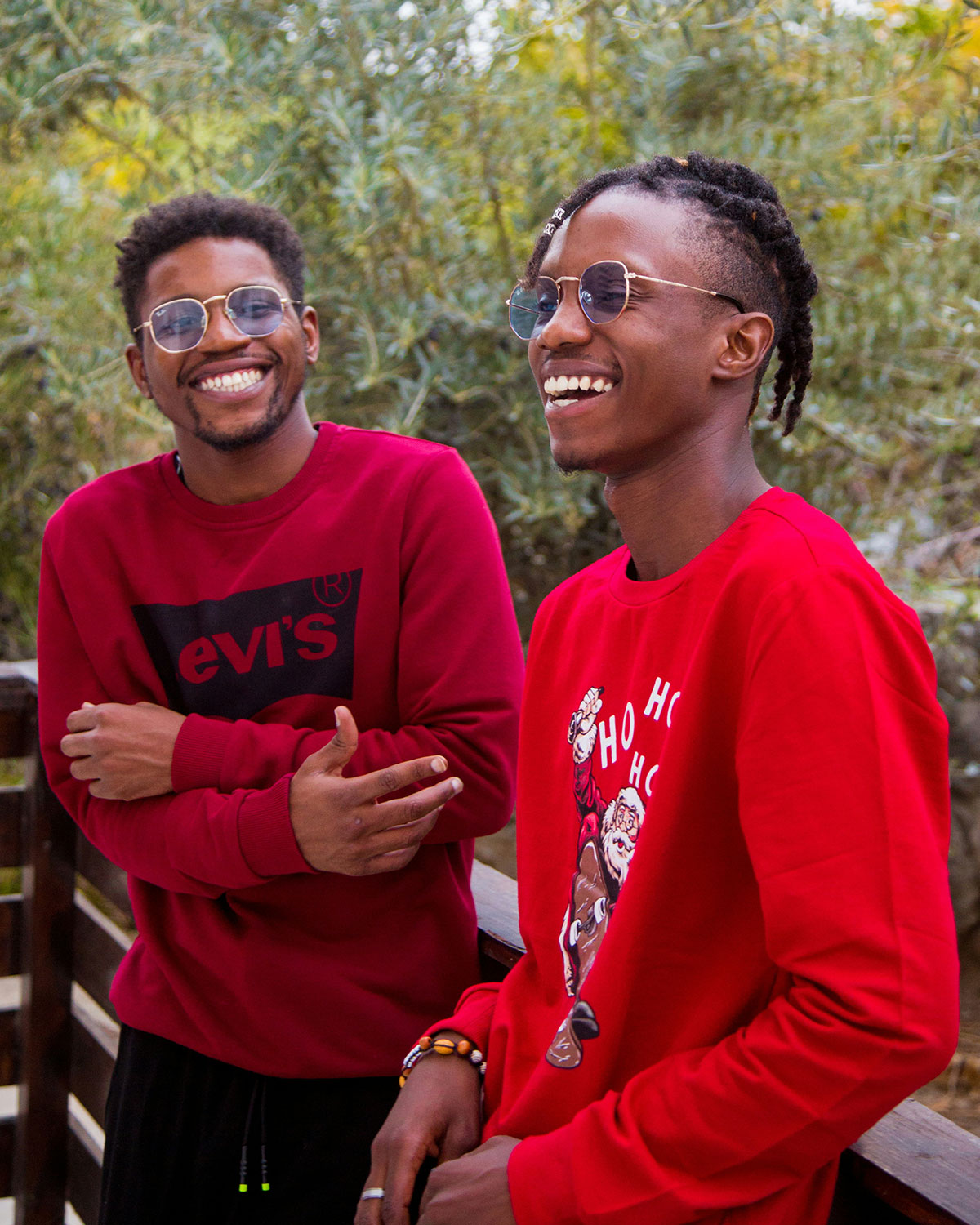 Two men in red laughing