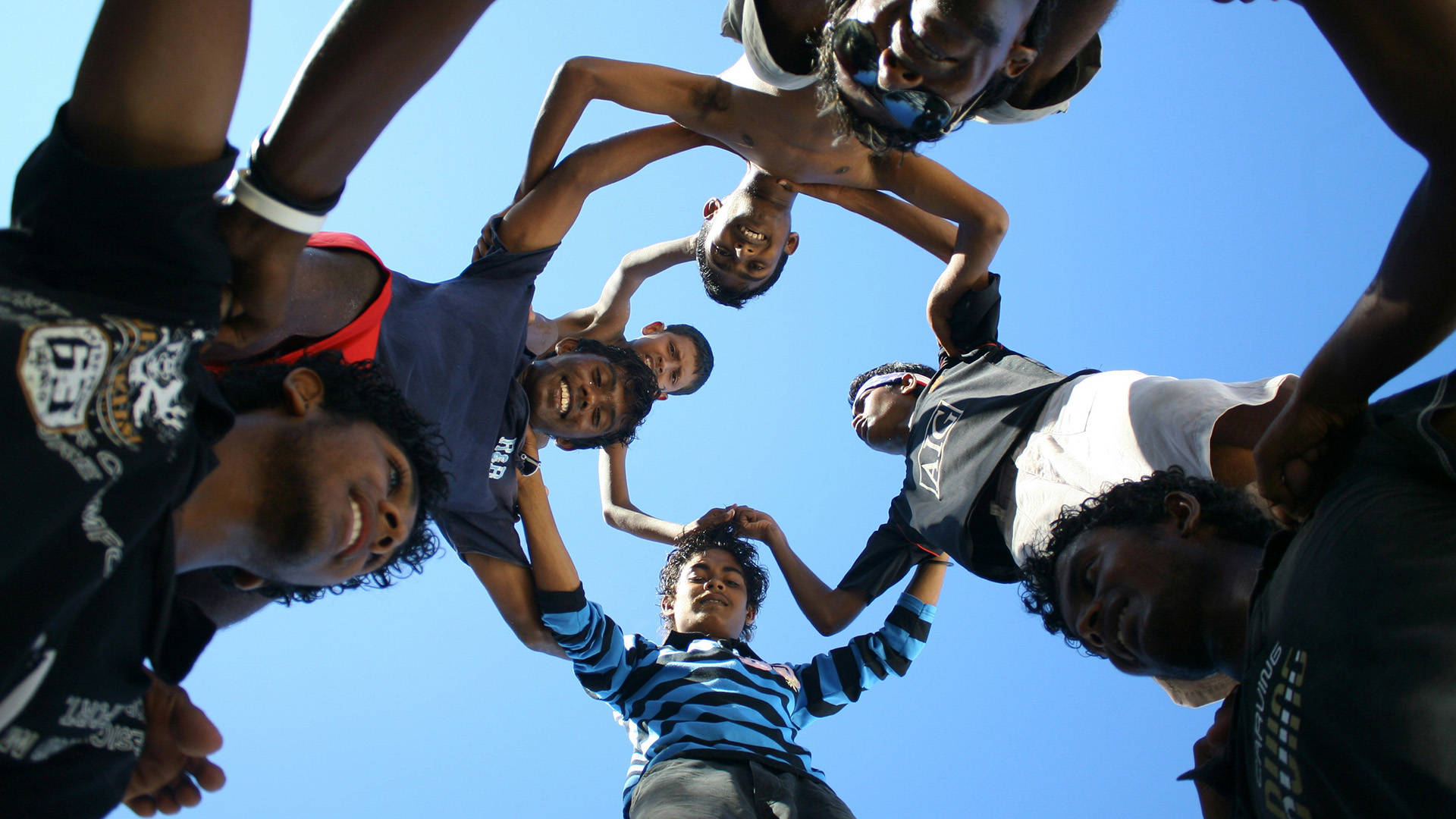 Young people making a circle